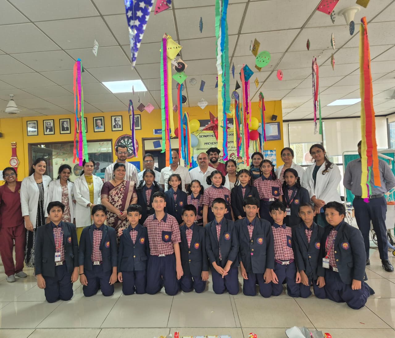 Group photo of students, faculty, and staff during Children's Day celebration